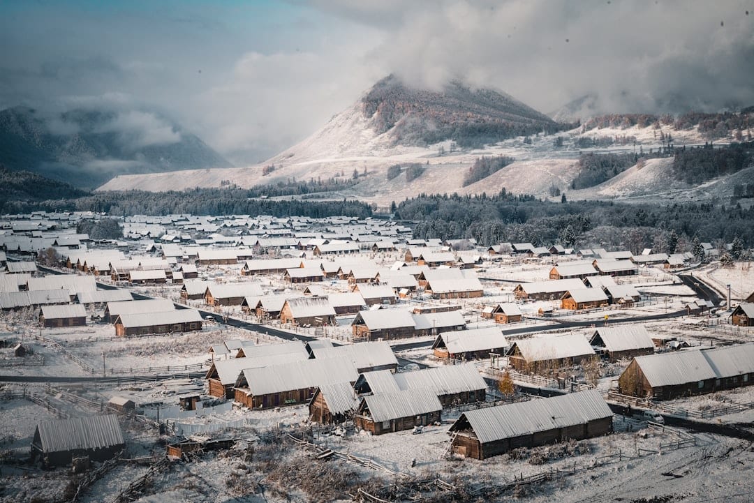 Traditional Chinese snow village with snow-covered wooden houses