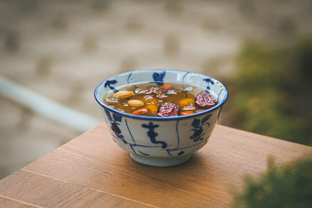 Traditional Guilin oil tea with fried rice and toppings
