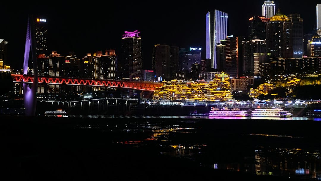Chongqing Hongya Cave illuminated at night along the Jialing River
