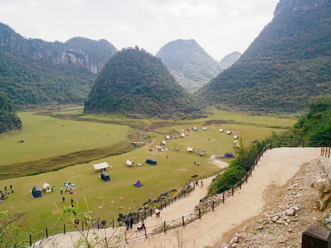 Guizhou terraced rice fields and traditional village in misty mountains