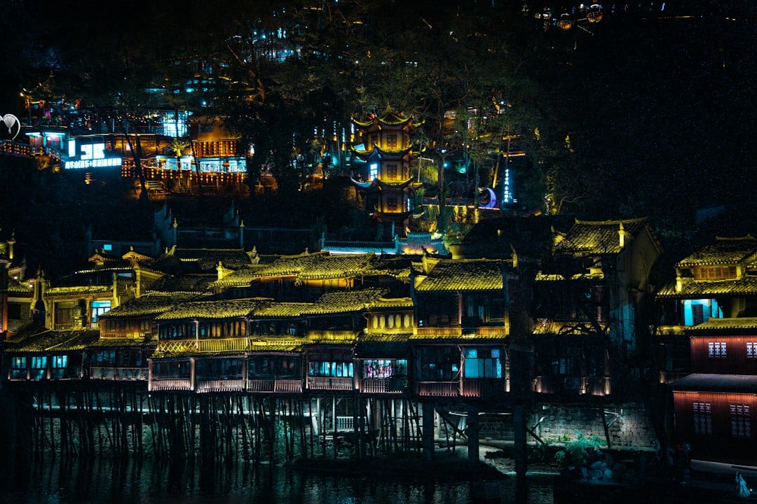 Xijiang Miao Village traditional stilt houses at night