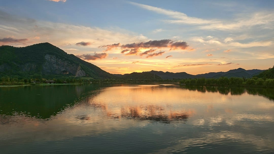 Li River winding through karst mountains at golden hour