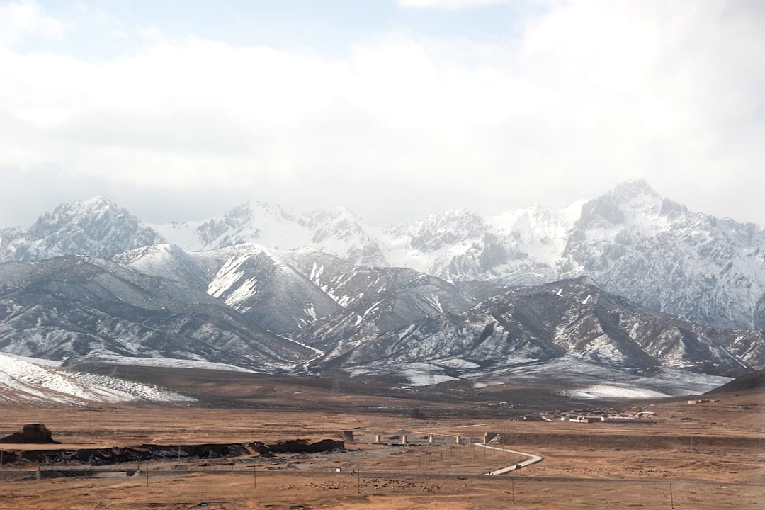 Sangke Grassland with mountain backdrop
